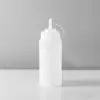Botella exprimible con tapa y escala, botella para condimento de ketchup, botella para ensalada, botella exprimible para mermelada y crema, botella con boquilla puntiaguda