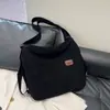 Bolsa de Ombro Fashion de Grande Capacidade para Mulheres 2025 Novo Estilo Simples e Versátil Estilo Coreano Bolsa Tote Mochila Casual para Viagem