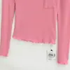 Atacado de roupas femininas transfronteiriças 2026 outono novo sexy garota popular bolso patch grande gola U longa manga longa camisa base overlock