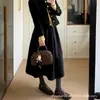 Falda de Lana Gris Oscuro con Botones para Mujer Otoño 2026 Nueva Falda de Cintura Alta Adelgazante Acampanada Falda Petite de Corte A