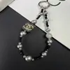 Cadena de Teléfono Exquisita Estilo Chanel de Perlas y Diamantes de Alta Gama, Accesorio Llavero de Bolso de Moda, Decoración Hecha a Mano con Perlas