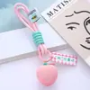 Llavero de cuerda de mano con colgante de fresa al por mayor, problemas y cosas buenas suceden, decoración de bolsa de regalo pequeña de fresa de moda en internet