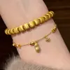 Xiaohongshu Más Vendido Nuevo Estilo Chino Anillo de Correr Forma de Cacahuete Cristal Amarillo Pulsera Collar Conjunto de Joyería de Ojo de Gato Venta al por Mayor