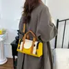 2026 Nuevo Bolso Redondo Cilíndrico de Bloques de Color de Moda Bolso de Mano Hombro Cruzado Bidireccional Multifuncional Casual Versátil para el Trabajo Bolso de Mujer Bolso de Mamá