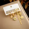 Aretes asimétricos de gota de aceite de margarita lisos de tres piezas diseño nicho aretes de metal de acero inoxidable transfronterizos Europa y Estados Unidos