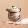 Juego de té de viaje kung fu de flor de durazno de fábrica traje para exteriores anti-caliente mano té taza rápida una tetera dos tazas bolsa portátil