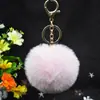 Al por mayor en stock Bola de pelo de imitación de conejo Rex de 8 cm llavero colgante lindo para mujer bolso de coche teléfono móvil colgante de felpa