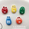 Caricatura Divertida M&M Expresión Frijoles de Caramelo Frijoles de Chocolate Accesorios de Resina Estuche de Teléfono DIY Decoración de Pasador Materiales de Parche