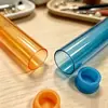 Embalagem de tubo de plástico transparente colorido de PVC, tubo de ensaio de armazenamento com rolha de plástico, tubo redondo rígido multicolorido, amostra grátis disponível