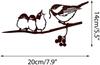 Colgante de metal con forma de pájaro amazónico transfronterizo en un árbol