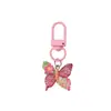 Llavero de resina con forma de mariposa de colores pastel, estilo lindo y dulce, colgante femenino, suministro para puestos callejeros y mercados nocturnos, accesorios de alta calidad al por mayor