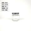 Venta al por mayor de fábrica botella hexagonal transparente de vidrio para miel multi-especificación botella vacía de miel y mermelada frasco hexagonal para alimentos Botella para pepinillos