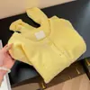 Suéter de ganchillo calado amarillo claro para mujer, protección solar, colección otoño 2026, suave y amigable con la piel, cárdigan de punto con cuello redondo