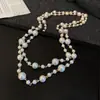 Collar Largo de Perlas Redondas de Personalidad Cruzada Estilo Retro Francés Hecho a Mano con Cuentas Cadena Larga para Suéter Europea y Americana Venta al por Mayor