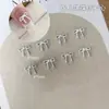 Joias Populares para Nail Art de Laço e Coração Mini Simples Fita Flutuante Prateada Combinada com Acessórios de Joias para Nail Art Douradas
