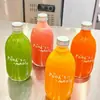 Nueva Botella Transparente de 500 ml para Jugo Cold Brew Gota de Hielo Estilo Celebridad de Internet Botella para Té de Leche Tarro de Vidrio Sellado para Agua Mineral