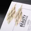 ¡Guau!Moda Transfronteriza Europea y Americana, Varios Pendientes Largos Metálicos de Borla Exagerada de Estilo Moderno con Elementos Elegantes