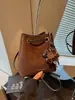 Bolso cubo coreano de mujer nuevo para otoño 2026 transfronterizo, moderno, versátil, elegante, simple, retro, de mano, de hombro y cruzado