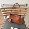 Bolsa de Axila Tecida de Design de Nicho Francês de Alta Qualidade Transfronteiriça 2025 Nova Bolsa de Balde de Ombro Casual Simples para Carregar na Mão