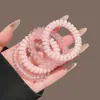 Corda Colorida de Dopamina para Cabeça para Mulheres Laço de Cabelo Doce em Formato de Fio de Telefone Elástico Simples para Prender o Cabelo Corda de Cabelo de Alta Elasticidade Durável