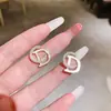 Pendientes de aro minimalistas con un diseño único, pendientes de nicho de plata de ley para mujer, lujo ligero con un toque de alta gama, pendientes de botón de perla, pendientes largos de borla