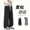 Jeans masculino casual, moderno, versátil, com cordão, cintura totalmente elástica, perna reta, solto, para o outono/inverno de 2026