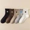 Nuevos calcetines de invierno, estilo coreano con lazo bordado, calcetines de terciopelo cálido para mujer hasta la pantorrilla, cálidos y gruesos, modernos y versátiles