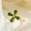 Nuevo producto transfronterizo: Anillo giratorio en forma de flor bañado en oro con esmalte amarillo verdoso y circonita, anillo abierto ajustable para mujer