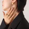 Pendientes sencillos de nicho estilo Joker ins, semicírculo hueco, pendientes de acero de titanio transfronterizos, joyería que no se decolora, joyería al por mayor
