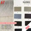 En stock 65% algodón, 25% lyocell, 10% nailon tejido 260g lino de imitación tejido de sarga de lyocell y nailon