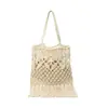 Nova bolsa feminina de verão estilo praia, grande capacidade, tecida com fio de algodão, com franjas e design vazado, moderna e versátil, pode ser carregada sob o braço ou como bolsa de ombro, simples e elegante