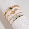 Moda Joyería Transfronteriza Nicho Pulsera de Gemas Ojos Verdes Incrustada con Diamantes Set Personalizado Pulsera Abierta en Forma de Serpiente Juego de Cuatro Piezas para Mujeres