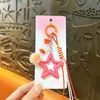 Encanto Creativo de Estrella de Cinco Puntas con Pompón para Bolso Llavero DIY Encanto Pequeña Regalo Dulce Encanto de Estrella Llavero