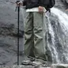 Calça de Assalto para Exterior 2025 Masculina Primavera e Outono Calças Cargo Funcionais Montanhismo À Prova de Vento e Impermeáveis Calças Casuais Retas Largas