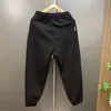 Novos estilos de outono e inverno: calças compridas casuais masculinas de cor sólida, corte solto, perna afunilada, estilo harém atlético, modernas e versáteis