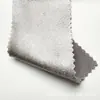 Tejido de satén elástico, grueso y brillante con una caída suave, que presenta un efecto reluciente de seda artificial, adecuado para disfraces de baile y ropa formal.