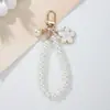 Nuevo Llavero Colgante Elegante de Flor de Perlas y Cuentas de Lujo Accesible Estilo Ins Exquisito Colgante de Flor de Perla para Bolso