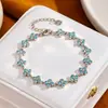Pulsera transfronteriza de diamantes de imitación blancos con diamantes de colores, sensación de lujo ligero y alta gama, estilo de moda europeo y americano, pulsera para mujer de alta gama al por mayor