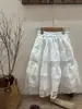 Conjunto de Falda para Niñas 2026 Verano Nuevo Estilo Hueco Seda de Hielo Manga Corta Top de Punto Top Redondo Infantil y Conjunto de Falda