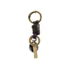 Nuevo cierre de resorte tejido a mano retro versátil llavero de piel de vaca accesorios de colgante semiacabados para DIY