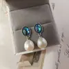 Nuevos pendientes de mujer de moda para comercio electrónico transfronterizo europeo y americano: perla natural, moda vintage popular, aretes creativos para dama