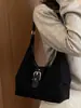 Bolso de mano sencillo y casual para mujer 2026 nuevo bolso de hombro retro coreano bolso cruzado de nicho para el trabajo