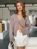 Calça de Malha Europeia e Americana com Gola V e Bolsos com Aba Cardigan 2025 Outono e Inverno Novo Design Solto Preguiçoso Macio e Aconchegante Jaqueta Suéter para Mulheres