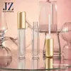 Productos en Stock: Botella Transparente Redonda con Tapa Dorada, Tubo para Brillo de Labios, Tubo para Color de Labios, Tubo de Plástico Vacío, Materiales de Empaque