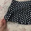 Falda corta mini plisada bodycon dulce y picante de línea A adelgazante Harajuku Y2K de lunares sexy caliente moda callejera retro de verano