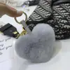 Colgante de Bolsa Lindo con Forma de Corazón de Piel de Conejo Llavero de Corazón de Felpa Bola de Piel con Forma de Corazón de Gama Alta Venta al por Mayor desde el Fabricante