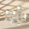 Ventas Directas de Fábrica de Botellas de Perfume de Vidrio en Stock, Botellas de Relleno de Perfume de Gama Alta, Botellas de Spray de Perfume con Nuevo Diseño Romano, Botellas Vacías