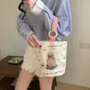 Venta al por mayor del fabricante Bolso de mano artístico de moda Bolso de lona Bolso tipo cubo de gran capacidad para mujer 2026 Nuevo Bolso para almuerzo de trabajo