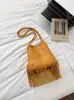 Bolso de flecos para mujer, nuevo estilo de moda de verano 2026, nicho de alta gama, bolso de hombro para ir al trabajo súper popular, bolso de axila, bolso tipo cubo