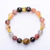 2025 Nuevo Pulsera de Cristal Súper Siete Negro Dorado Natural Flor de Flor de Pegamento de Cristal Torre Amarilla Flor de Pegamento Rojo para Hombres y Mujeres